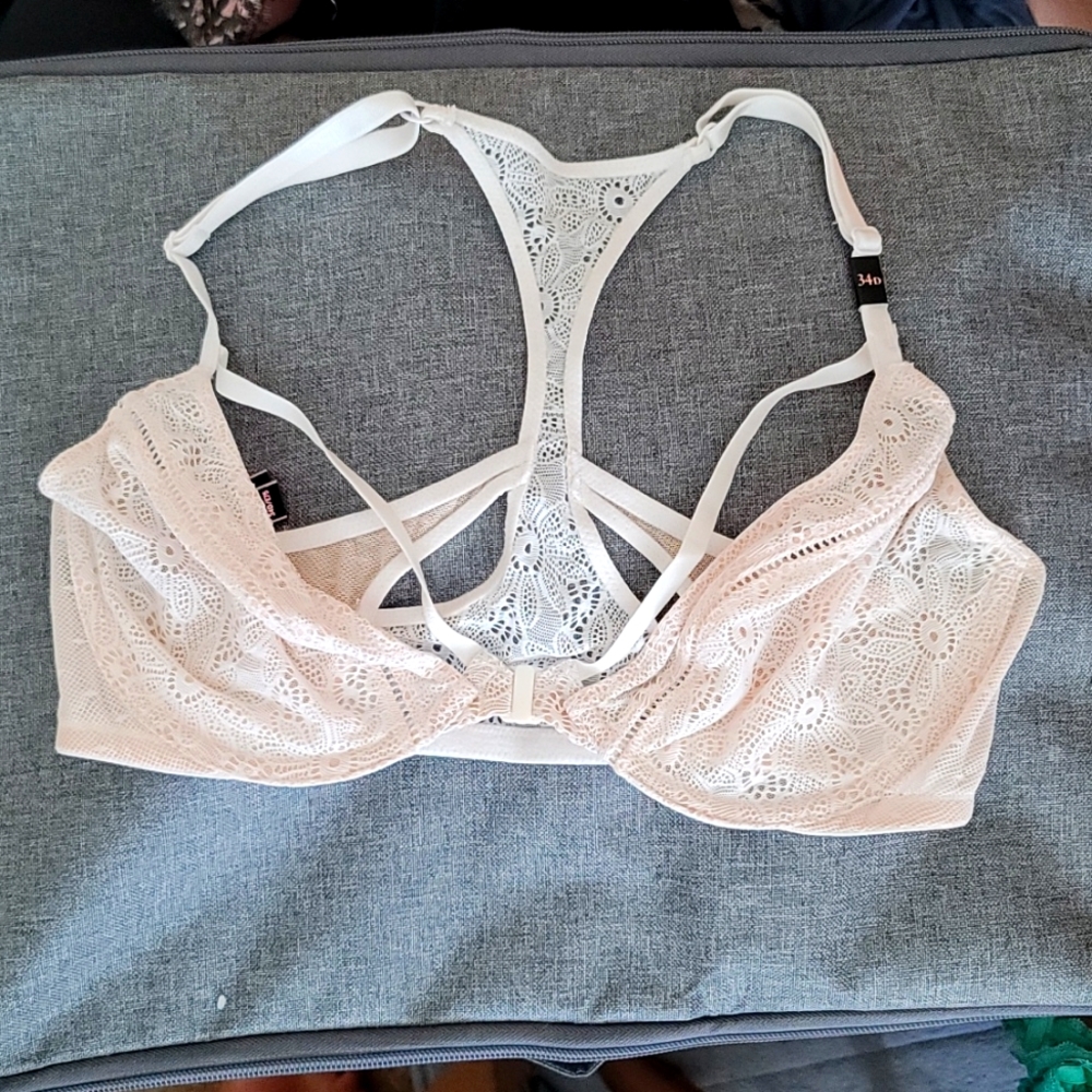 34D unpadded bra. Cream colored